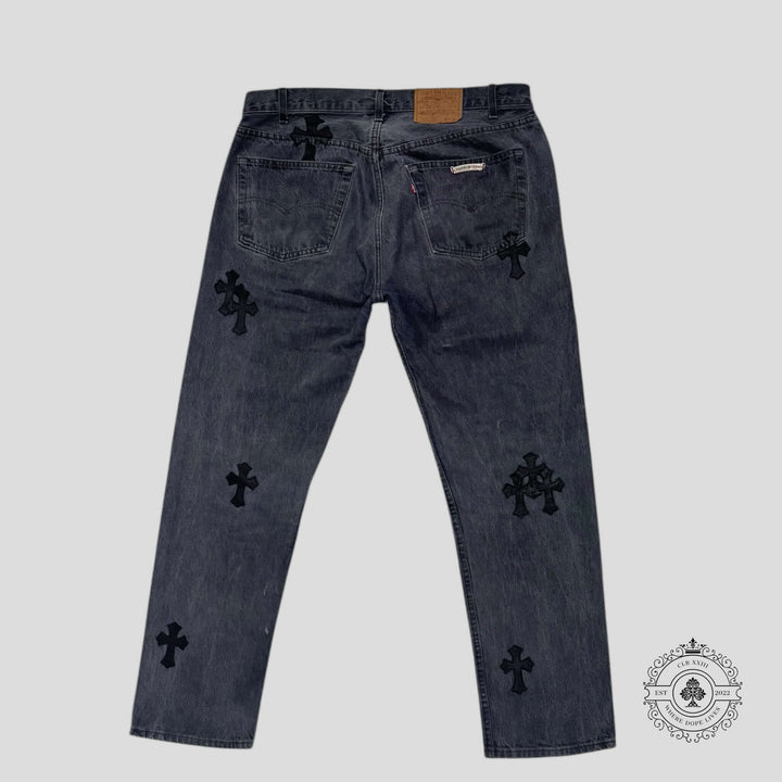Chrome Hearts Levi Cross Patch Jeans in Black featuring unique cross patches on the back.