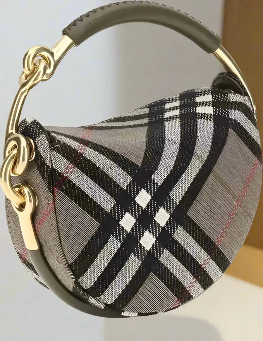 Plaid patterned handbag with gold handle on a white background