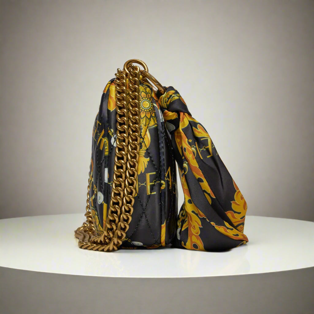 Versace Jeans Couture shoulder bag with gold emblem, quilted synthetic leather in vibrant colors, featuring a chain strap.