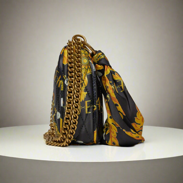 Versace Jeans Couture shoulder bag with gold emblem, quilted synthetic leather in vibrant colors, featuring a chain strap.