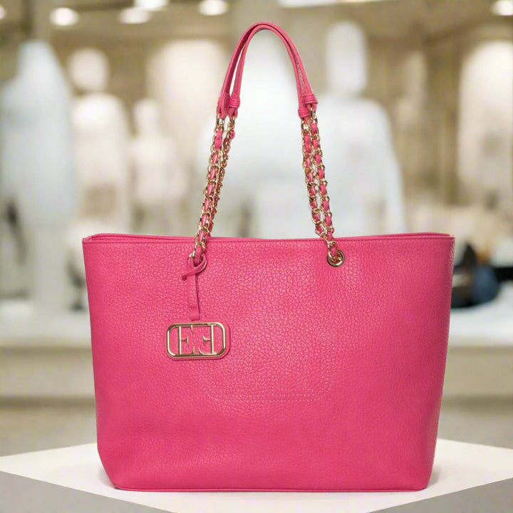 Pink handbag with a chain detail on a white background