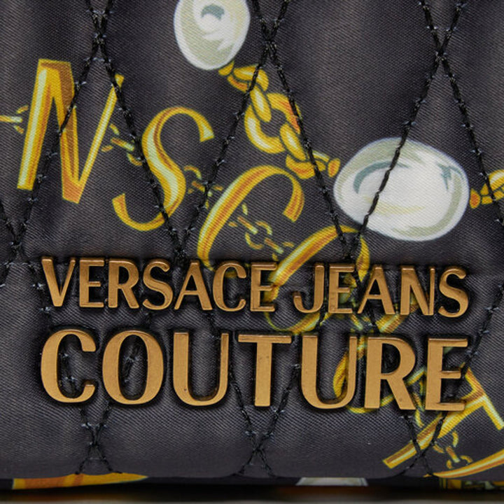 Close-up of Versace Jeans Couture logo on synthetic leather shoulder bag with gold emblem, showcasing luxury design.