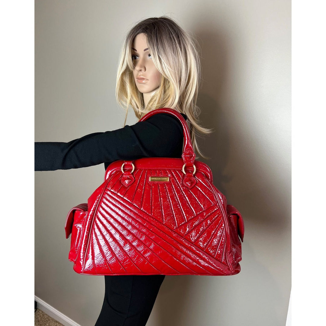 Isabella Fiore Red Patent Leather Hand bag displayed on a mannequin showcasing luxury bags style and design.