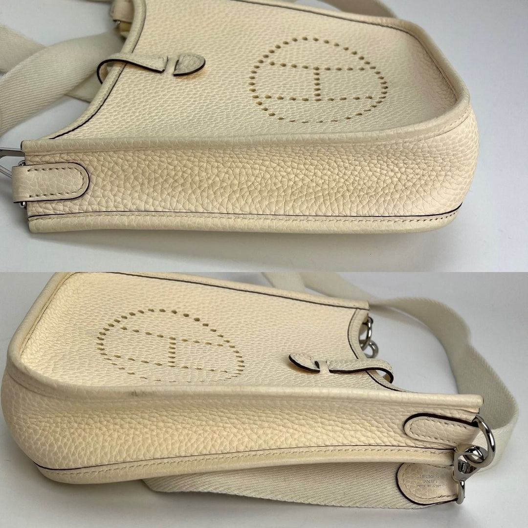 Beige handbag with visible brand logo on a white background