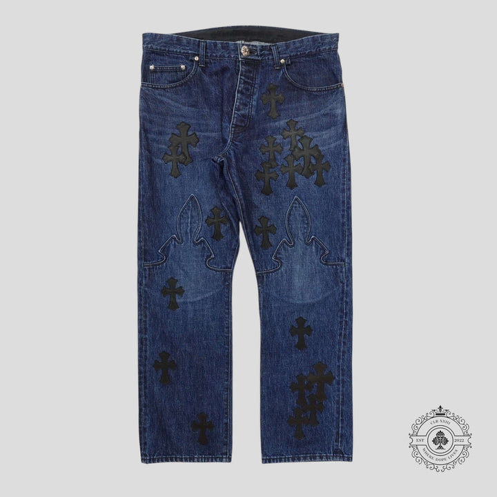 Chrome Hearts Fleur Knee Cross Patch Jeans in Dark Wash/Black showcasing unique patchwork design and luxury denim quality.