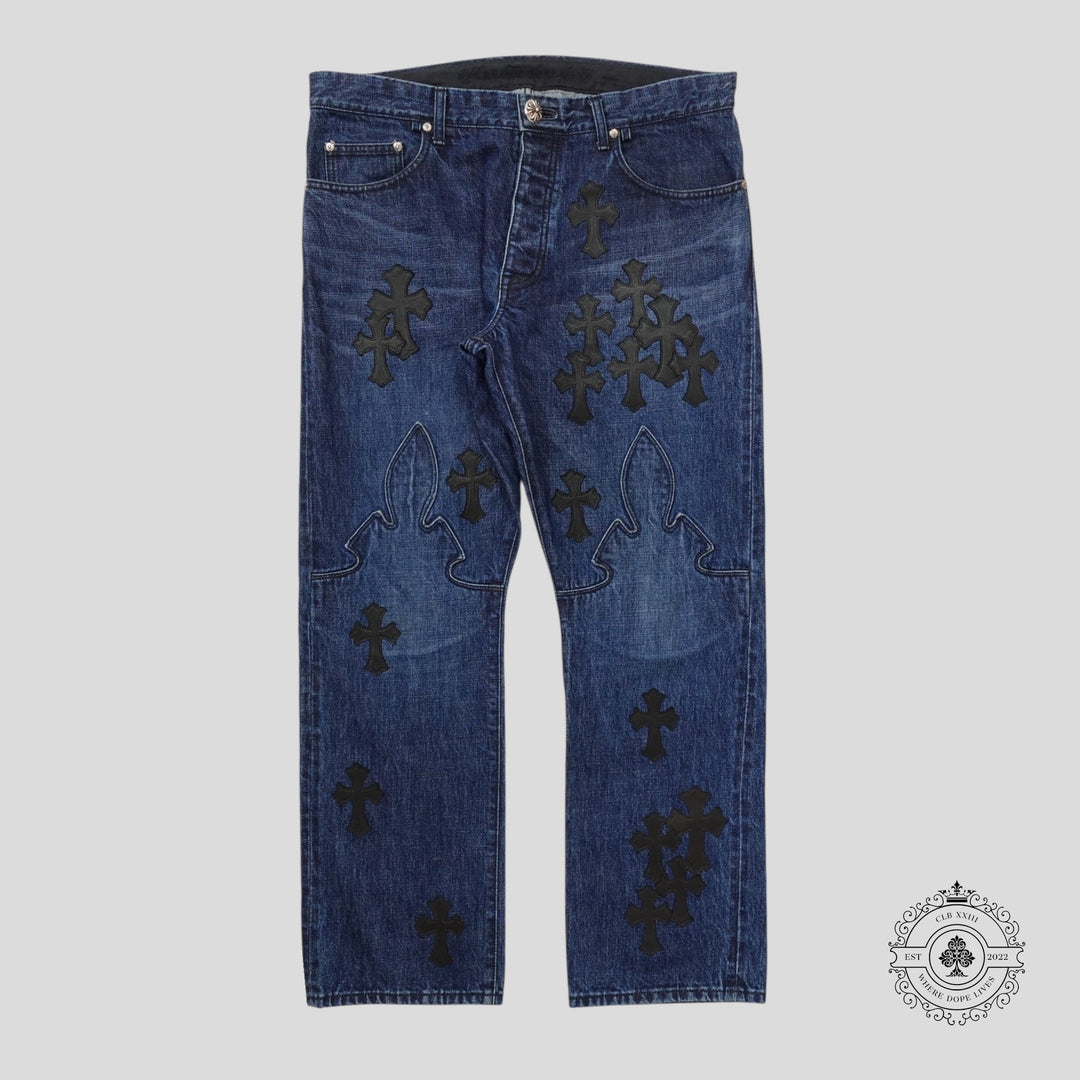 Blue jeans with black cross patterns on a gray background