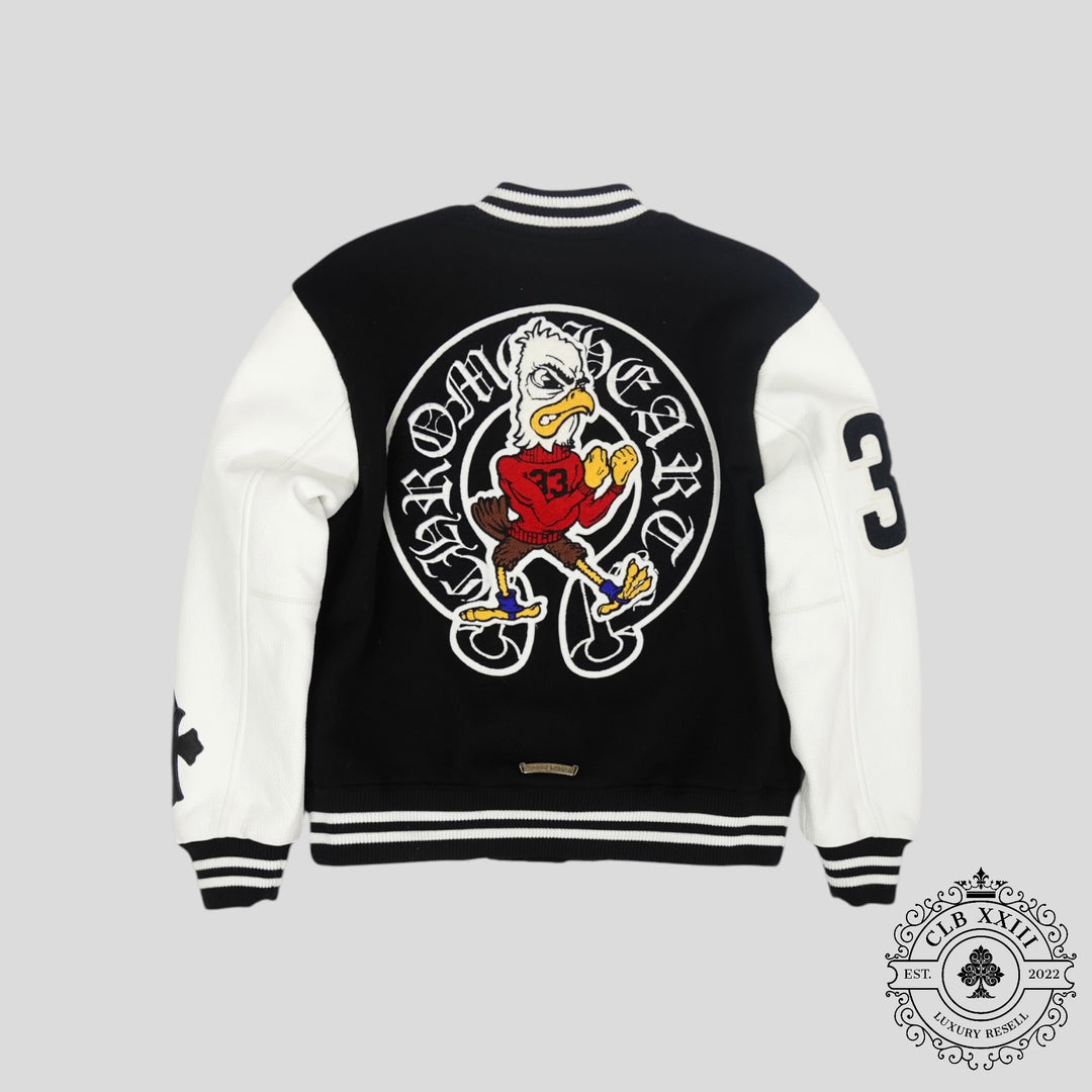 Black and white varsity jacket with cartoon character design on a gray background