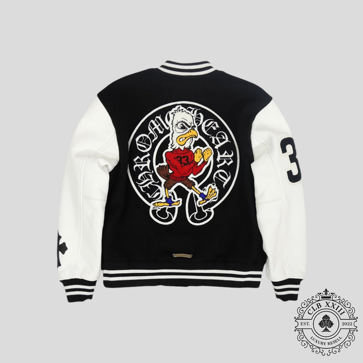Black and white varsity jacket with cartoon character design on a gray background
