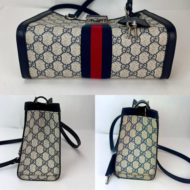 Gucci GG Supreme Dollar Calfskin Web Small Padlock Navy Tote showcasing its luxurious design and quality craftsmanship.