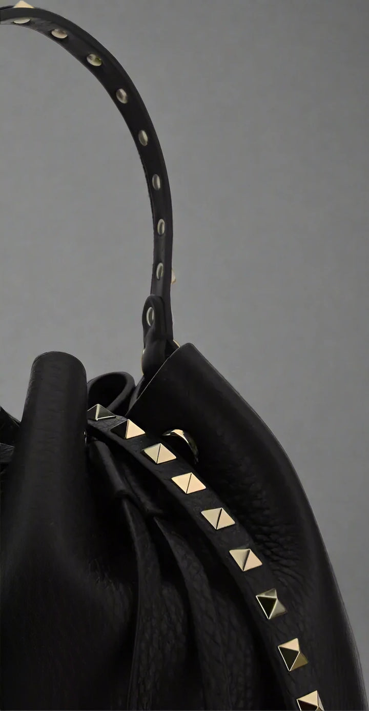 Valentino Garavani women's designer handbag in leather Luxury Valentino Garavani shoulder bag with iconic studs Valentino Garavani crossbody bag in black with gold accents