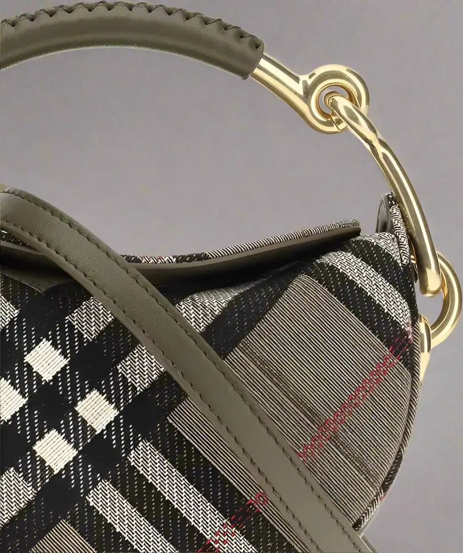 Plaid patterned handbag with gold handle on a white background