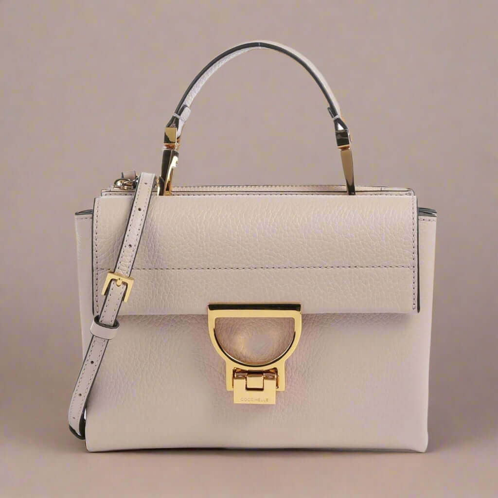 Coccinelle beige leather buckled Crossbody Bags