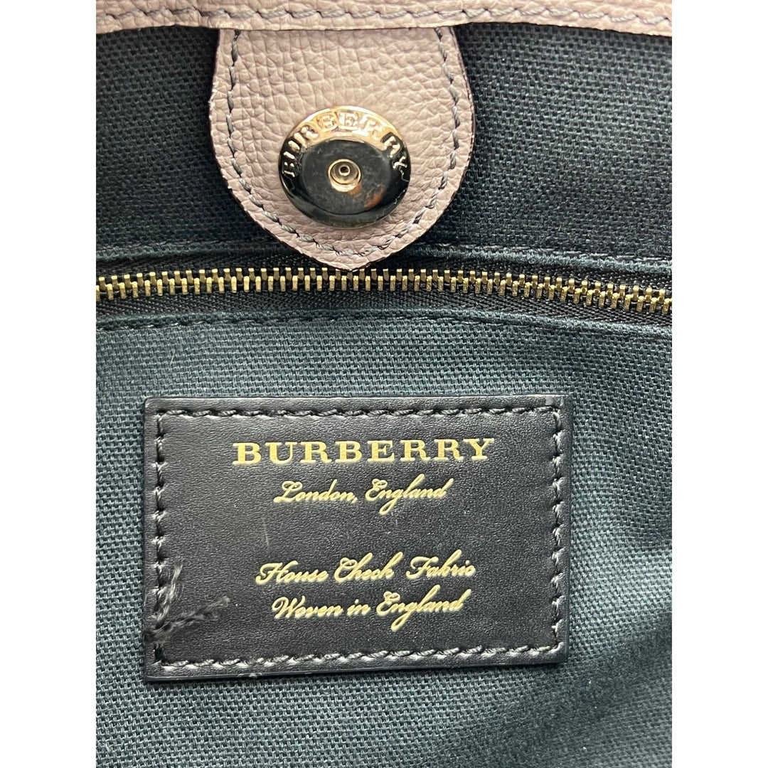Burberry bag with visible brand label on a gray background