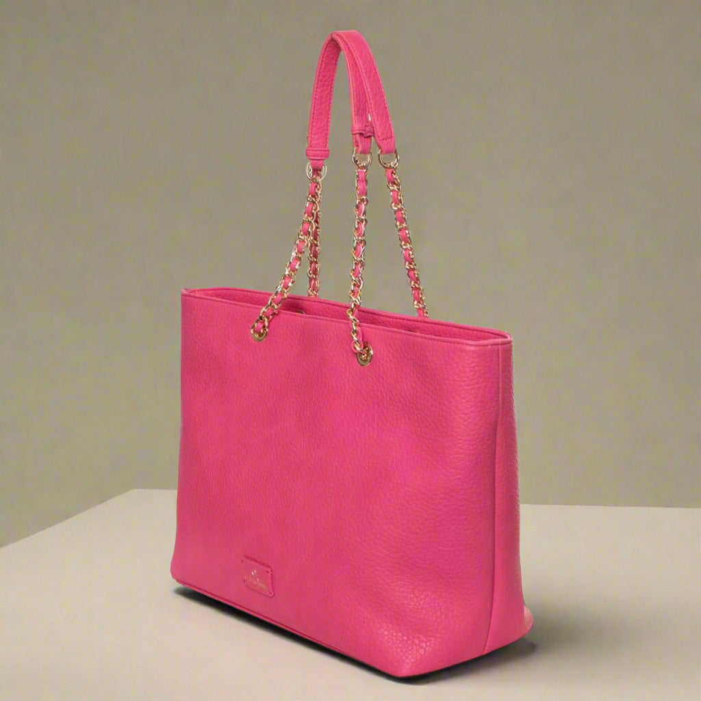 Pink handbag with chain detail on a white background