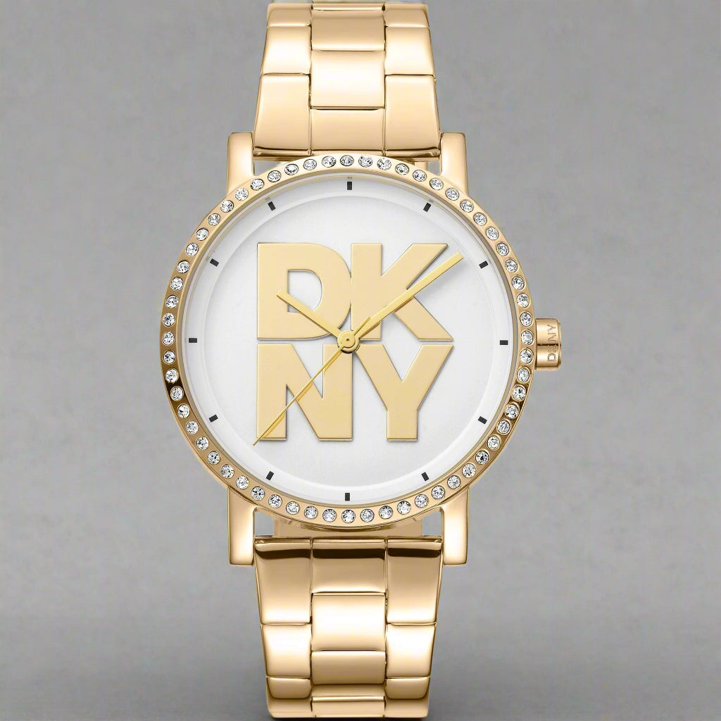 DKNY women's white dial gold tone Watches with center logo