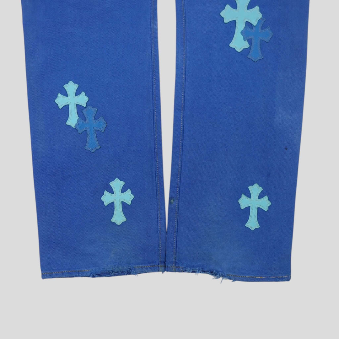Chrome Hearts Levis Cross Patch Jeans in Blue featuring unique cross patches on luxury denim, showcasing rarity and authenticity.