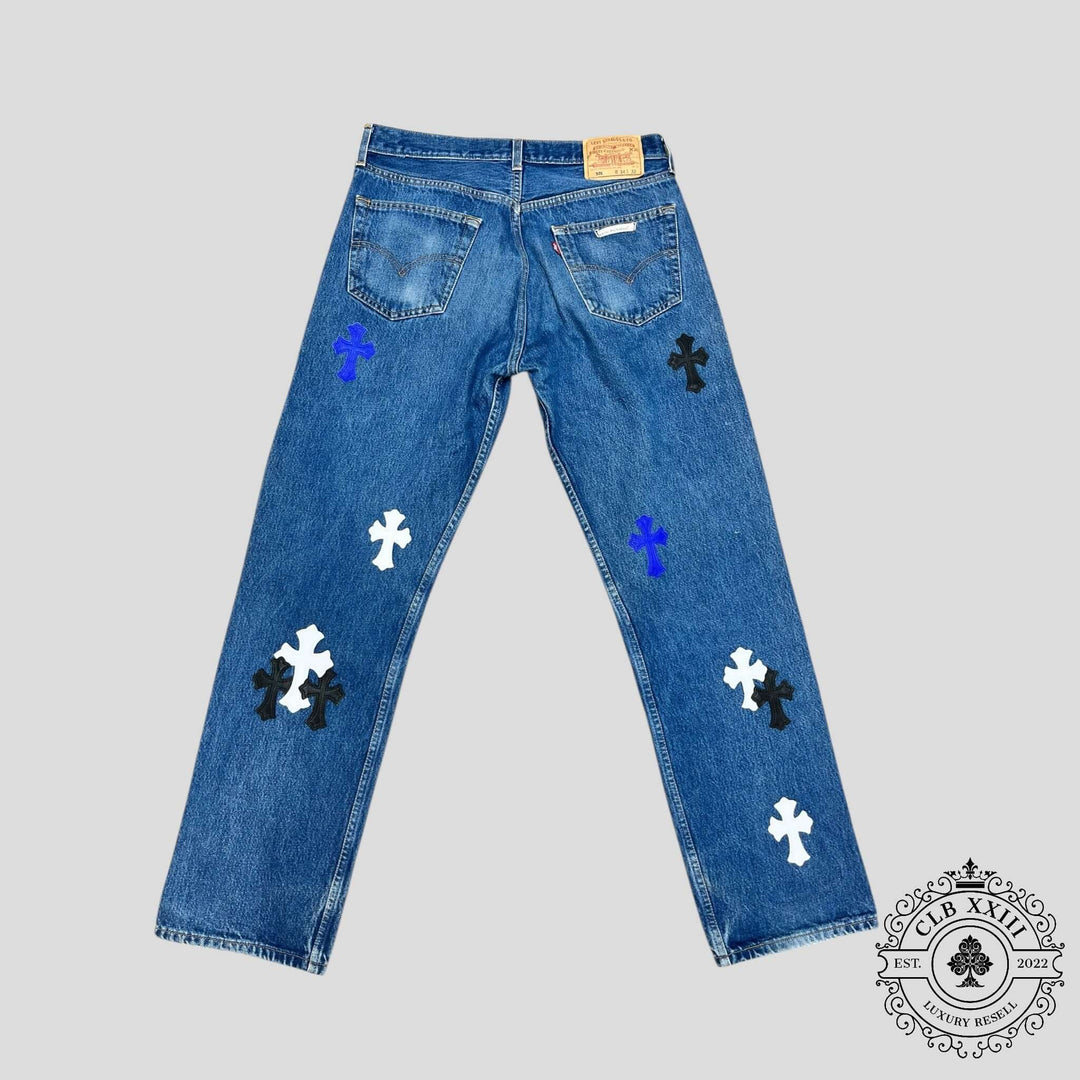 Chrome Hearts Levi Patch Jeans in Black/Blue/White showcasing rare patchwork design in luxury denim style.