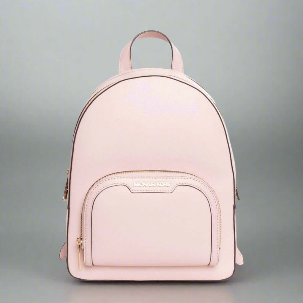 Pink backpack with a visible brand logo on a white background