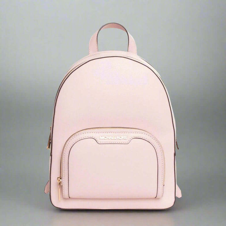 Pink backpack with a visible brand logo on a white background