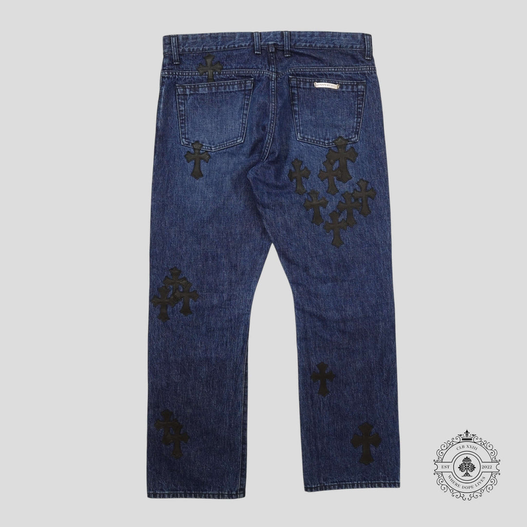 Chrome Hearts Fleur Knee Cross Patch Jeans in Dark Wash/Black showcasing unique patchwork, perfect for luxury denim lovers.