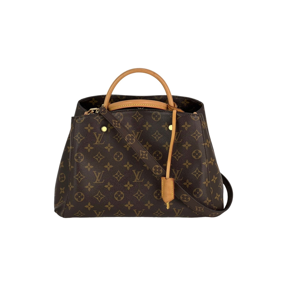 Designer handbag with monogram pattern on a white background