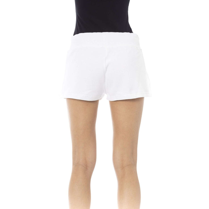 White athletic shorts worn by a person on a white background