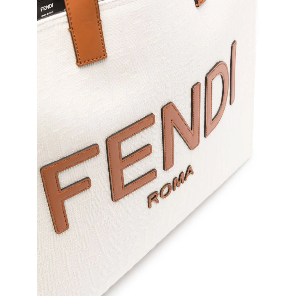 Fendi bag with brown logo and strap on a white background