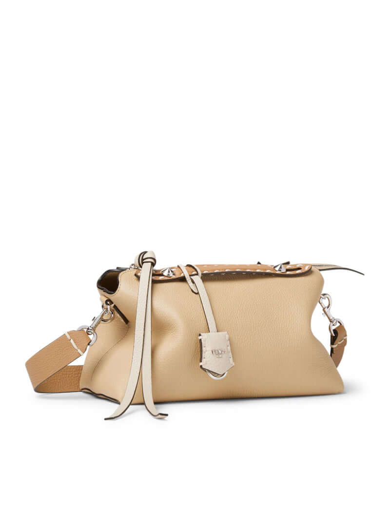 Beige handbag with a visible brand logo on a white background