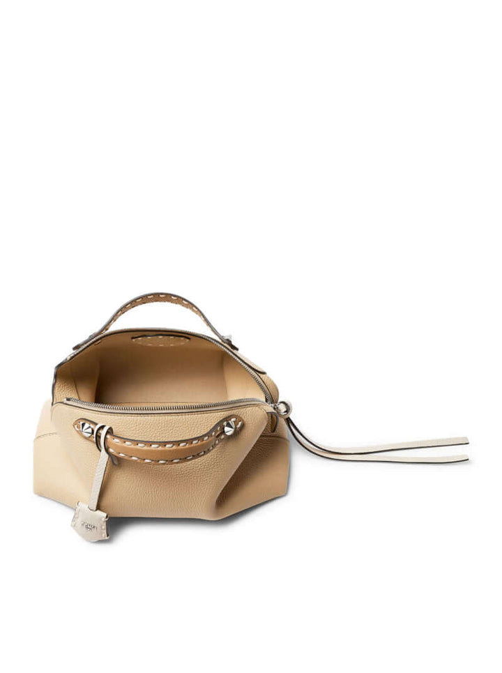 Beige handbag with a shoulder strap on a white background