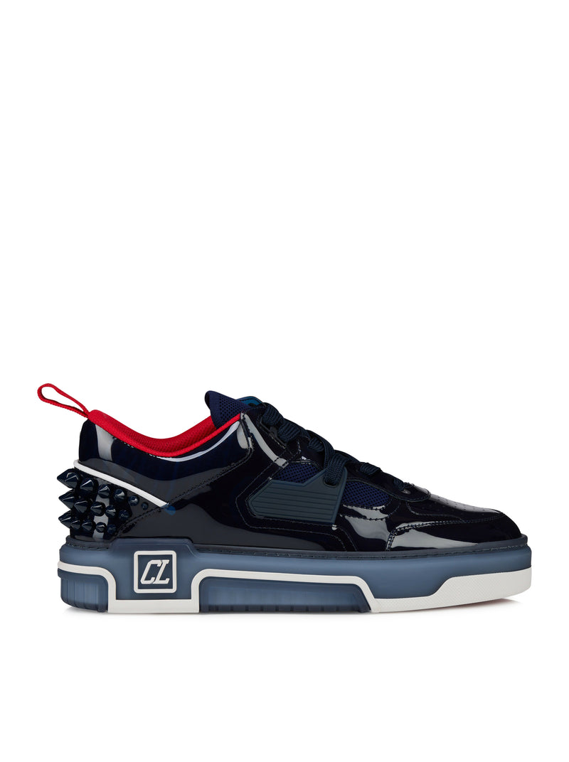 Black and blue sneaker with red accents on a white background