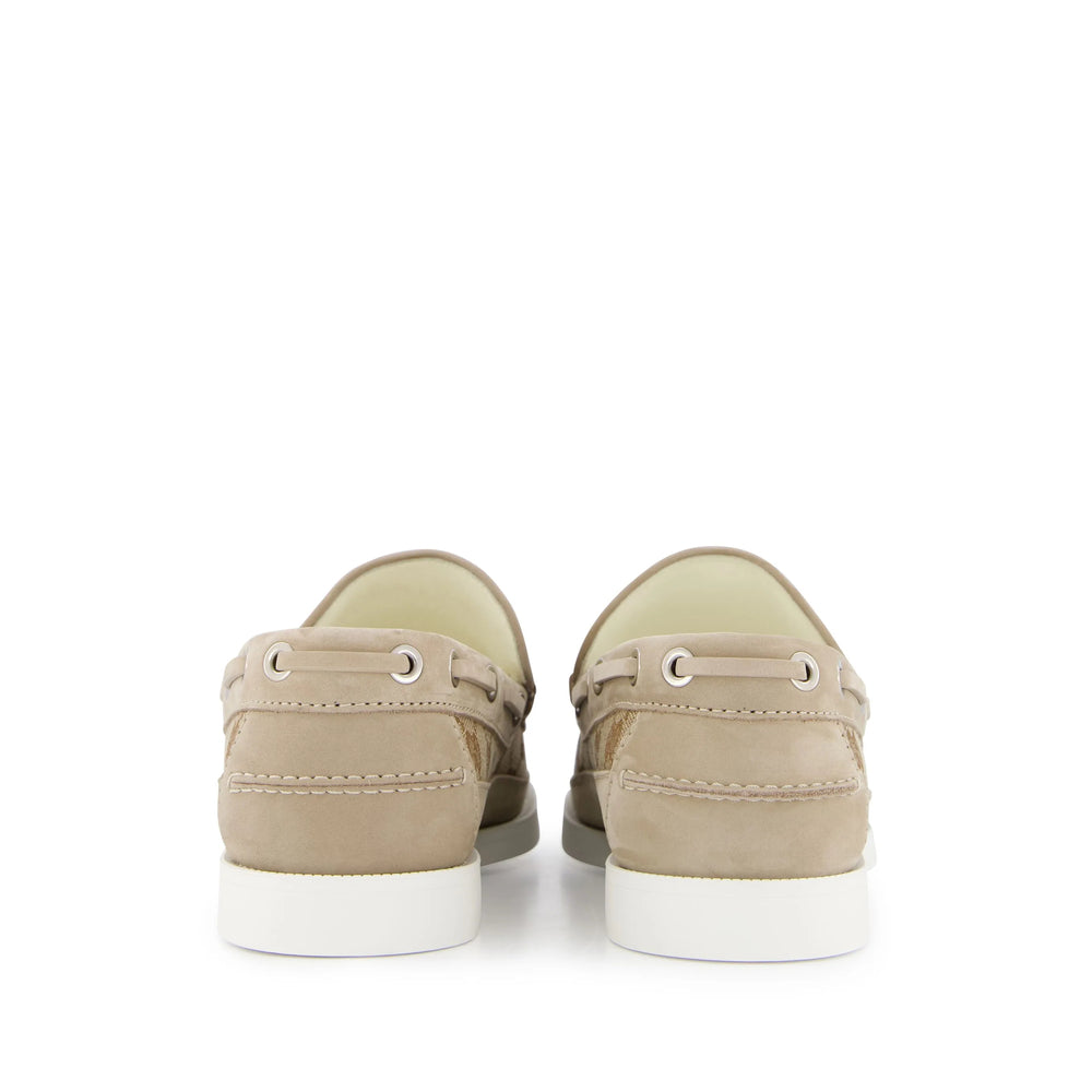 Pair of beige sneakers on a white background