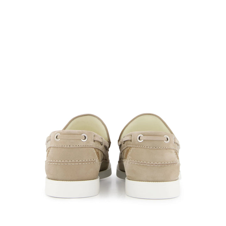 Pair of beige sneakers on a white background