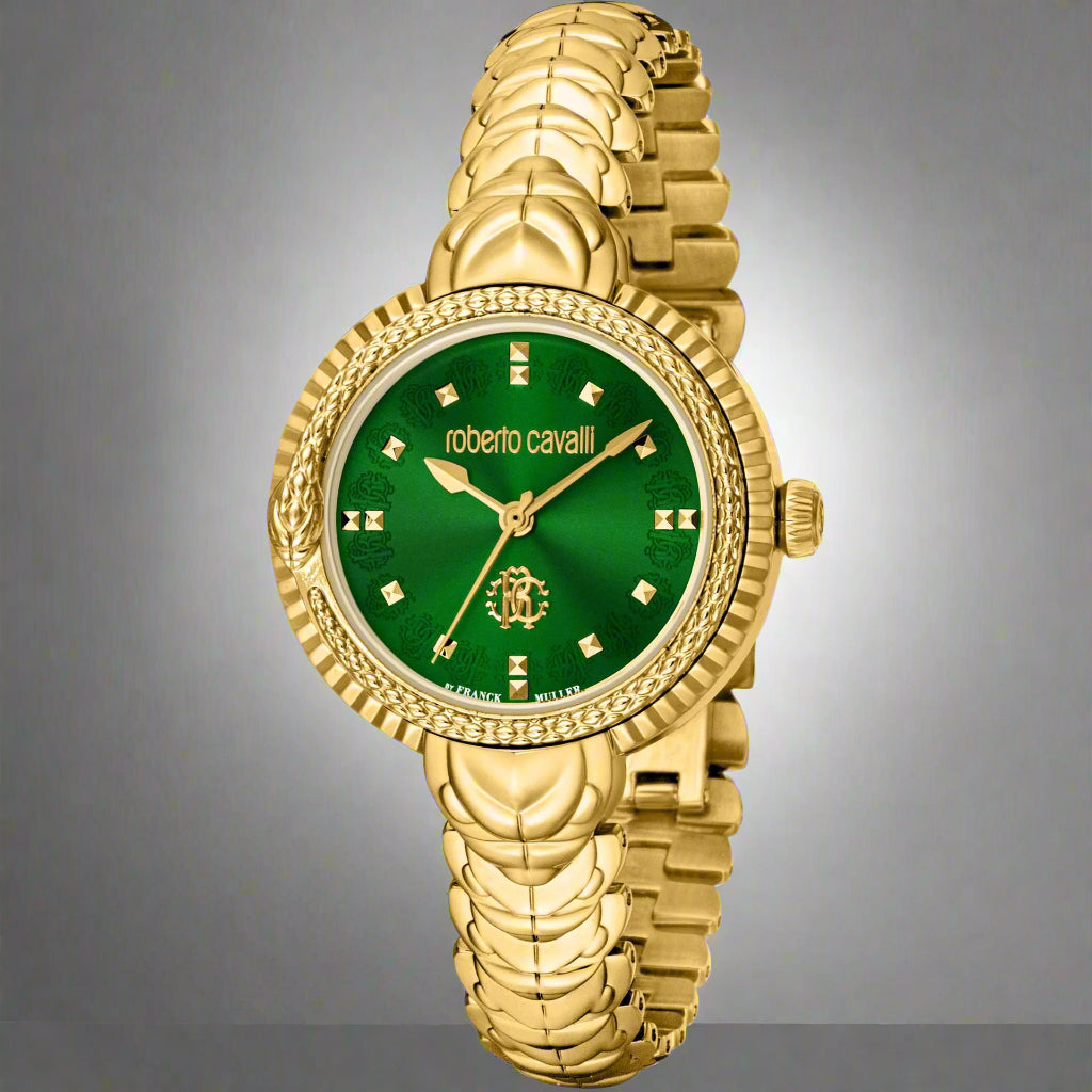 Women's gold tone green dial watch