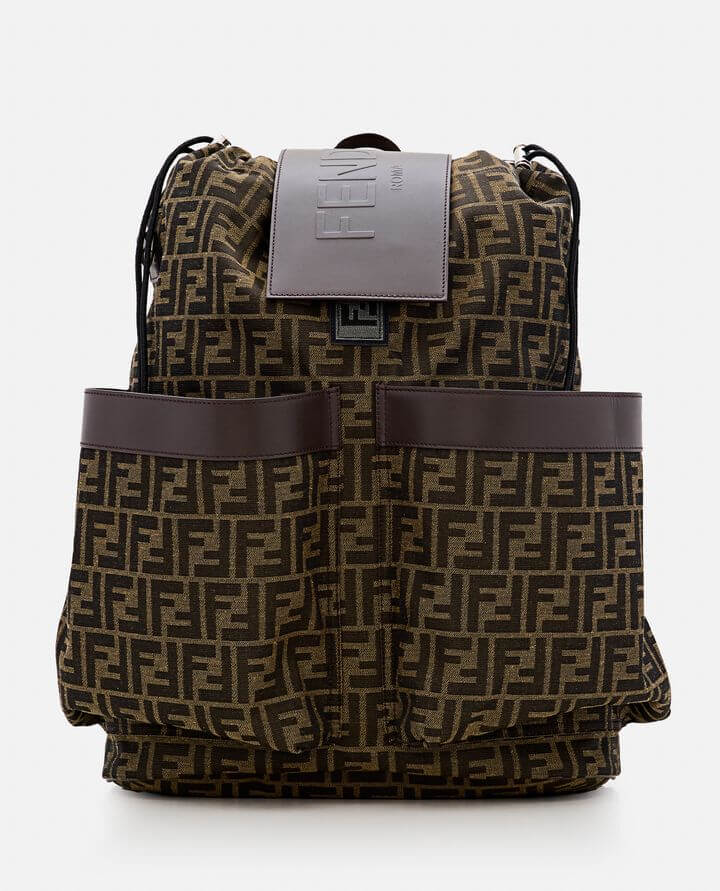 Brown patterned backpack with a visible brand logo on a white background