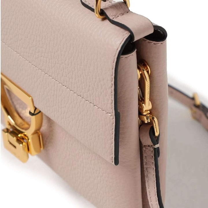 Beige handbag with gold hardware on a white background