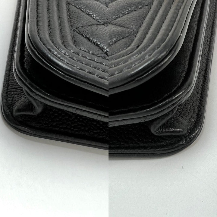 Close-up view of Chanel Caviar Quilted Mini Boy Clutch Wallet on a Chain Black, showcasing quilted texture and details.