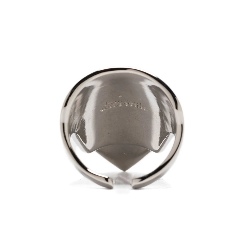 Silver ring with a reflective surface on a white background