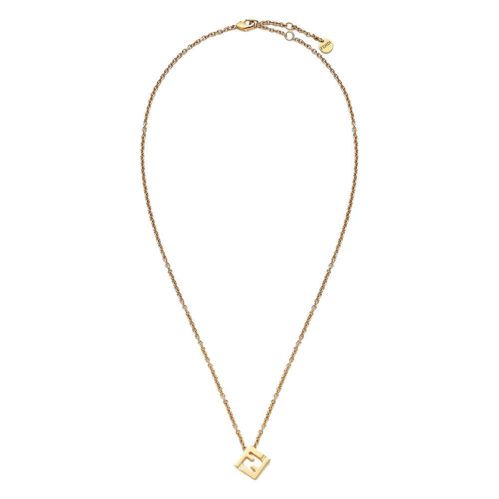 Gold necklace with a square pendant on a white background