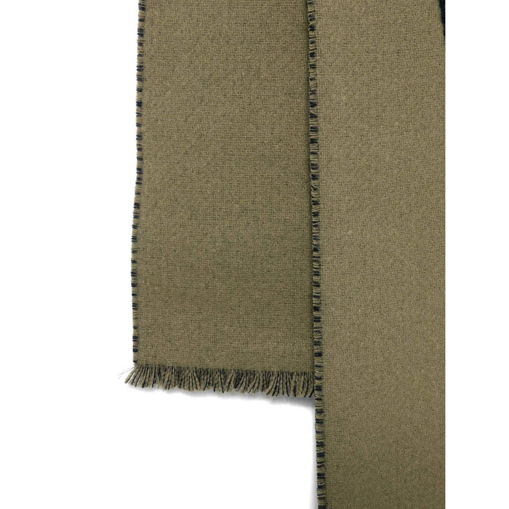 Green fabric with frayed edge on a white background