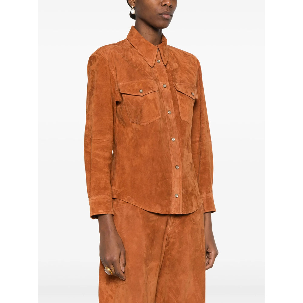 Person wearing a brown suede outfit on a white background
