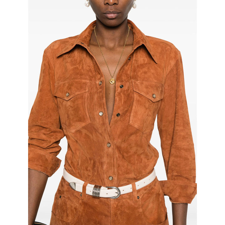 Person wearing a brown suede jacket with a white background