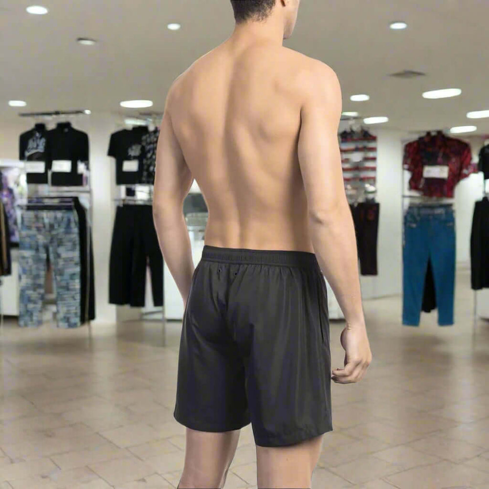 Men’s Bikkembergs beachwear and swimwear collection at STORE 7994 featuring modern swim trunks and sporty beach styles for summer.