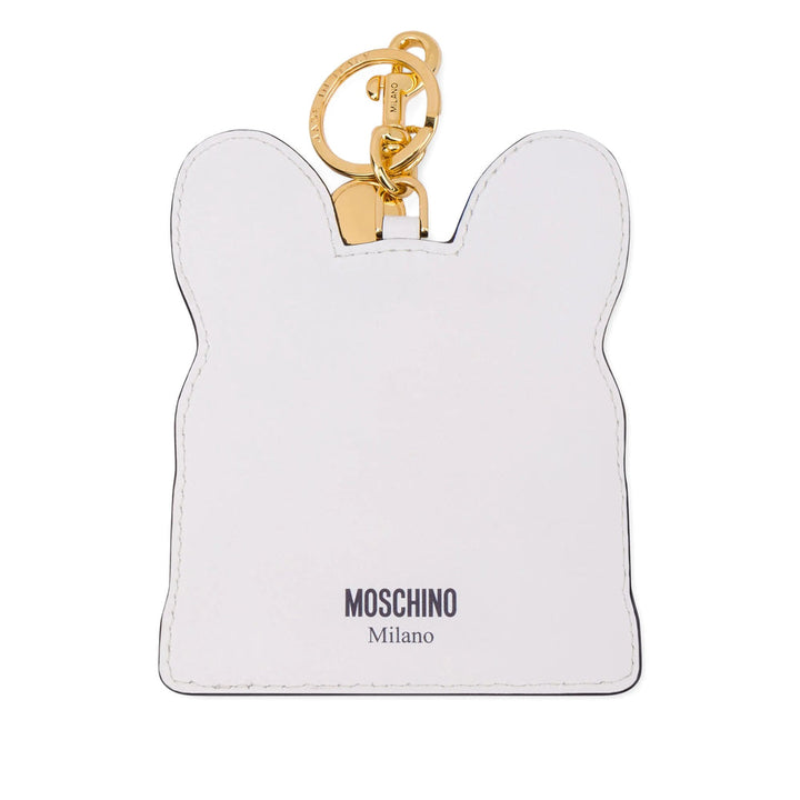 White rabbit-shaped keychain with gold clasp and Moschino branding on a white background