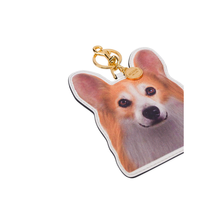 Dog-shaped keychain with a gold clasp on a white background