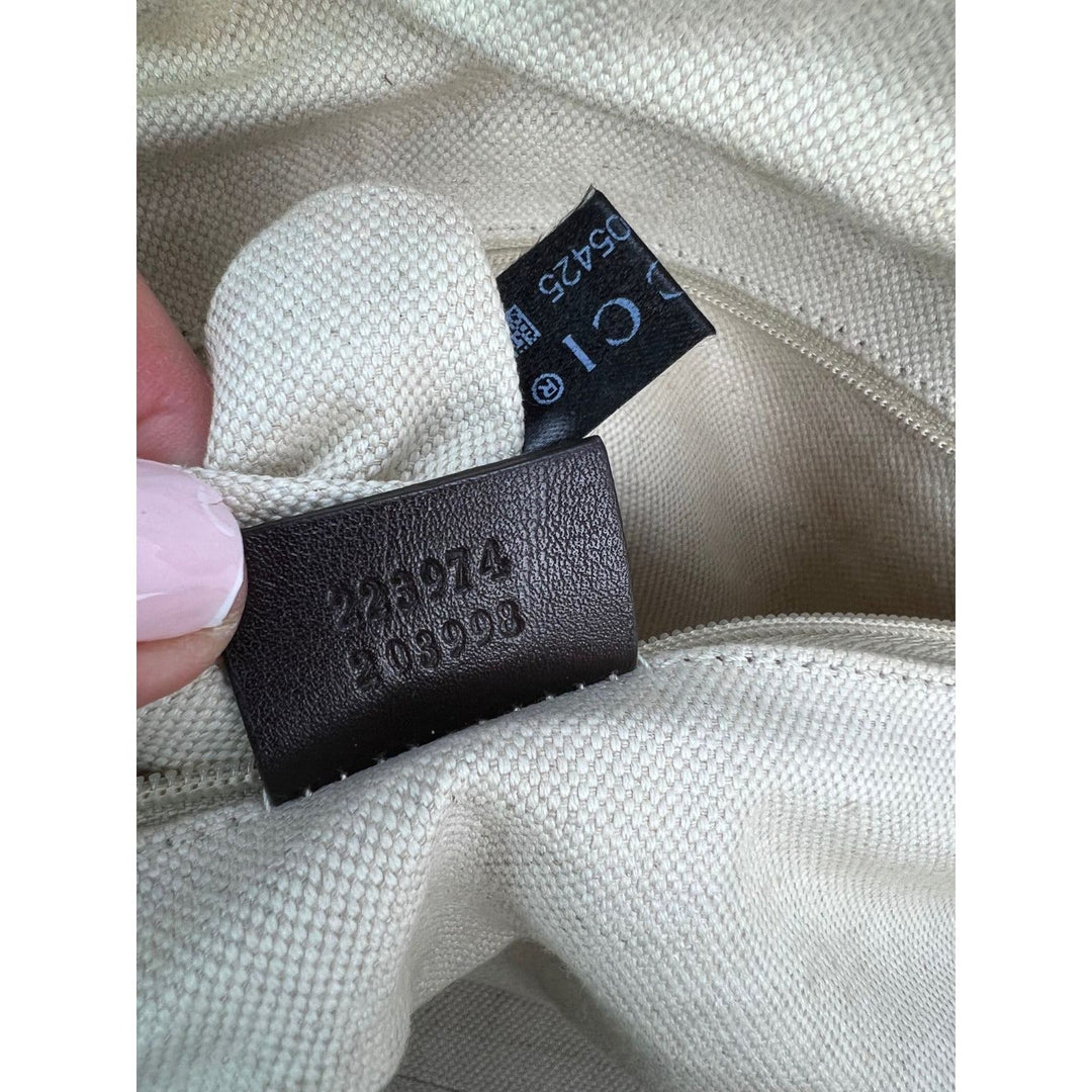 Close-up of a fabric tag with numbers on a beige background