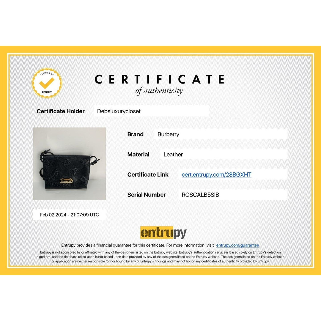 Burberry handbag with a certificate of authenticity from Entripy on a white background