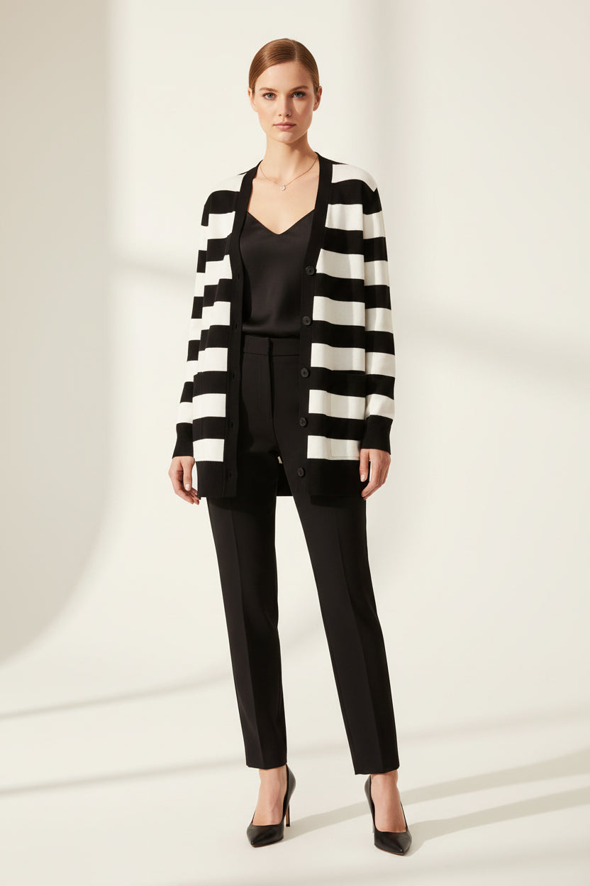 Black and white striped cardigan on a white background