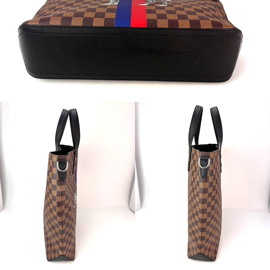 Checkered patterned bag with black base and red and blue stripe, displayed on a white background.