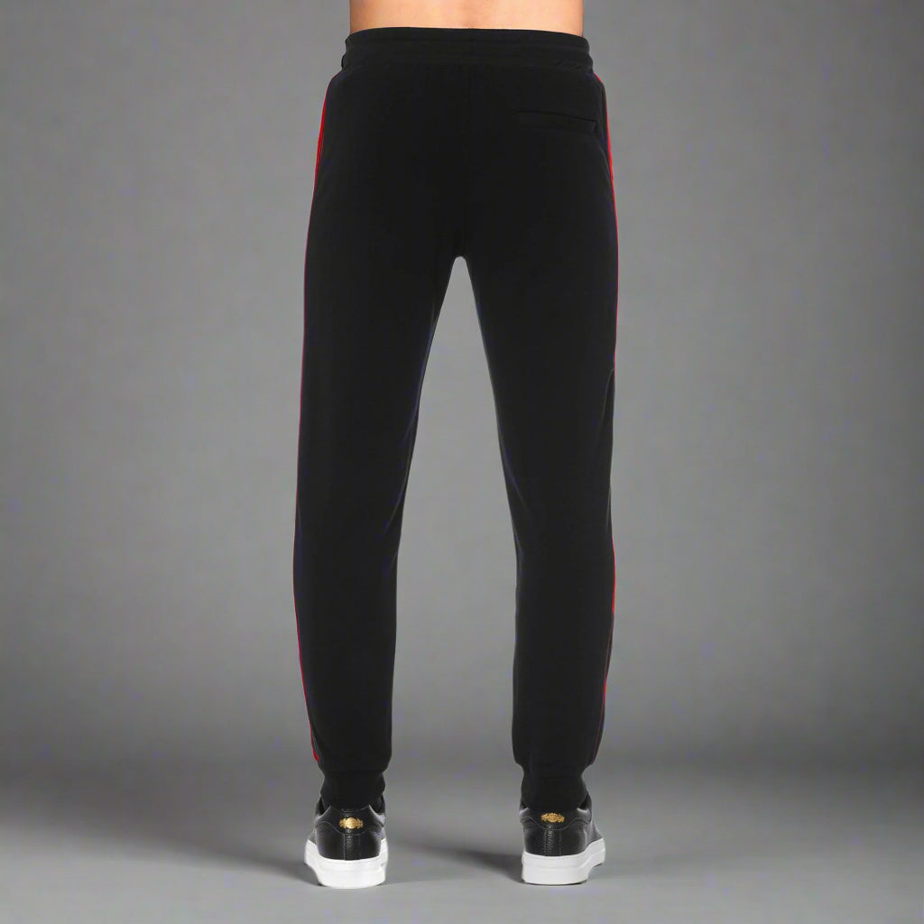 Black joggers with red side stripes