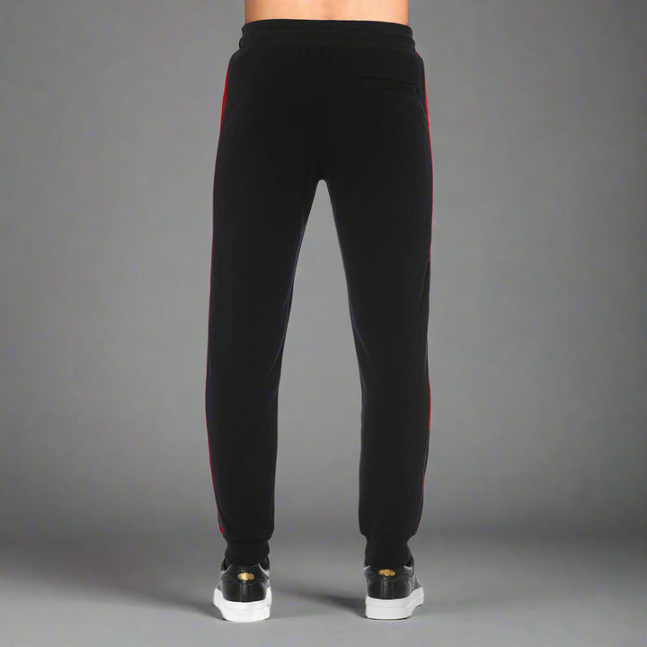 Black joggers with red side stripes
